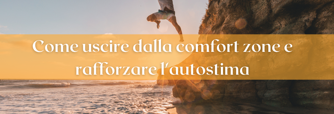 uomo che fa un grande salto da uno scoglio